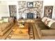 Living room with stone fireplace, built-in shelving, and ample seating at 404 E Paseo De Isabella --, Casa Grande, AZ 85122