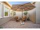 A shaded courtyard with two comfortable chairs and potted plants at 4414 W Gold Pan Pl, Phoenix, AZ 85087