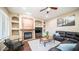 Living room with fireplace, hardwood floors, and comfortable seating at 4582 S Wildflower Pl, Chandler, AZ 85248