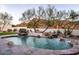 Relaxing kidney shaped pool with waterfall feature and mountain views at 4711 E Marston Dr, Paradise Valley, AZ 85253