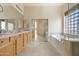 Elegant bathroom with double sinks, soaking tub, and a walk-in shower at 5209 E Sierra Sunset Trl, Cave Creek, AZ 85331