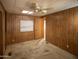 Bedroom with mirrored closet doors and wood paneling at 6960 W Peoria Ave # 16, Peoria, AZ 85345