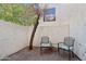 Small patio with two chairs and a small table at 7024 E 6Th St # 103, Scottsdale, AZ 85251