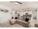 Open living room with L-shaped sofa and view into the kitchen at 7262 E Mallard Ct, San Tan Valley, AZ 85143