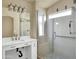 Modern bathroom with white vanity, glass shower, and tile accents at 8339 W Bluefield Ave, Peoria, AZ 85382