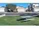 House exterior with a grassy front yard and a picnic table at 8852 W Charleston Ave, Peoria, AZ 85382