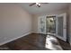 Bright bedroom with wood floors and access to a private balcony at 933 E Driftwood Dr, Tempe, AZ 85283