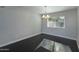 Bright dining room with dark hardwood floors and a large window at 933 E Driftwood Dr, Tempe, AZ 85283