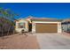 One-story house with brown garage door and desert landscaping at 9394 E Silo Rd, Florence, AZ 85132