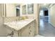 Guest bathroom with single sink, granite countertop and updated fixtures at 10063 E Cinnabar Ave, Scottsdale, AZ 85258