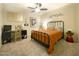 Cozy bedroom with a queen-size bed, a workspace, and plenty of natural light at 10063 E Cinnabar Ave, Scottsdale, AZ 85258