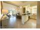Open concept kitchen with island and view into living area at 10063 E Cinnabar Ave, Scottsdale, AZ 85258
