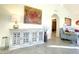 Living room with decorative console table and art at 10063 E Cinnabar Ave, Scottsdale, AZ 85258