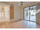 Dining room with tile floors and sliding glass doors leading to a patio at 11857 N 81St St, Scottsdale, AZ 85260