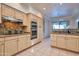 Spacious kitchen with light wood cabinets, granite countertops, and stainless steel appliances at 11857 N 81St St, Scottsdale, AZ 85260