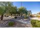 Landscaped community grounds with mature trees and walkways at 13324 W Stonebrook Dr, Sun City West, AZ 85375