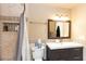 Updated bathroom with a tub, shower, and modern vanity at 1401 E Puget Ave # 24, Phoenix, AZ 85020