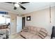 Comfortable bedroom with a sofa and ceiling fan at 1401 E Puget Ave # 24, Phoenix, AZ 85020