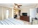 Spacious bedroom with a ceiling fan, dresser and access to the bathroom at 1401 E Puget Ave # 24, Phoenix, AZ 85020