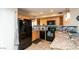 Well-equipped kitchen with granite counters and wood cabinets at 1401 E Puget Ave # 24, Phoenix, AZ 85020