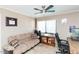 Home office features a sofa, desk, and window with blinds at 1401 E Puget Ave # 24, Phoenix, AZ 85020