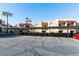 Exterior view of condo building with assigned parking spaces under covered carport at 1401 E Puget Ave # 24, Phoenix, AZ 85020
