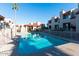 Community pool with surrounding patio and building views at 1401 E Puget Ave # 24, Phoenix, AZ 85020