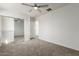 Spacious bedroom with mirrored closet and ceiling fan at 1430 E Douglas St, Casa Grande, AZ 85122