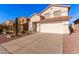 Two-story house with a white garage door and terracotta roof tiles at 18036 W Cardinal Dr, Goodyear, AZ 85338