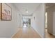 Light and bright hallway with wood-look flooring, leading to living spaces at 1805 E Grenadine Rd, Phoenix, AZ 85040