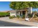 Two-story house with a three-car garage and mature trees at 18080 W Desert Ln, Surprise, AZ 85388