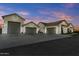 Spacious three-car garage with attached workshop at 18131 E Indiana Ave, Queen Creek, AZ 85142