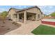 Covered patio with hot tub and artificial turf at 20539 W Rosewood Ln, Buckeye, AZ 85396