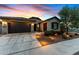 Stunning curb appeal with landscaped yard, driveway, and garage at 20539 W Rosewood Ln, Buckeye, AZ 85396