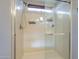 Clean shower with glass enclosure and storage shelf at 29381 N 123Rd Ave, Peoria, AZ 85383