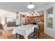 Kitchen with wood cabinets, a dining area, and access to the backyard at 2950 E Laurel St, Mesa, AZ 85213