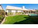 Inviting backyard oasis with sparkling pool, lush lawn, and mature landscaping at 4113 W Bart Dr, Chandler, AZ 85226