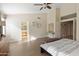 Bright bedroom with a large bed, dresser, and ensuite bathroom access at 4113 W Bart Dr, Chandler, AZ 85226