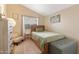 Cozy bedroom with wood bed frame and a window with curtains at 4113 W Bart Dr, Chandler, AZ 85226