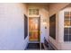 Front entrance with a wooden door and sidelights at 4113 W Bart Dr, Chandler, AZ 85226