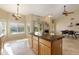 Kitchen island with granite top and view of the dining and pool areas at 4113 W Bart Dr, Chandler, AZ 85226