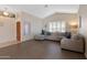 Spacious living room featuring a sectional sofa and wood-look floors at 4113 W Bart Dr, Chandler, AZ 85226