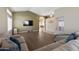 Open living room with L-shaped sofa and a view to the dining area at 4113 W Bart Dr, Chandler, AZ 85226