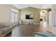 Living room with L-shaped sofa and wood-look flooring at 4113 W Bart Dr, Chandler, AZ 85226