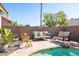 Spacious pool area with seating and desert landscaping at 4113 W Bart Dr, Chandler, AZ 85226