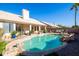 Inviting kidney-shaped pool with a relaxing patio area at 4113 W Bart Dr, Chandler, AZ 85226