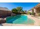 Inviting kidney shaped pool with rock waterfall feature at 4113 W Bart Dr, Chandler, AZ 85226