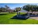 Park with covered picnic area and benches, surrounded by trees at 4248 E Loma Vista St, Gilbert, AZ 85295