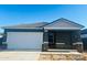 New construction home with a two-car garage and neutral color palette at 5647 E Orion Rd, Florence, AZ 85132