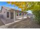 Home's backyard with covered patio, and nice landscaping at 6402 S Callaway Dr, Chandler, AZ 85249